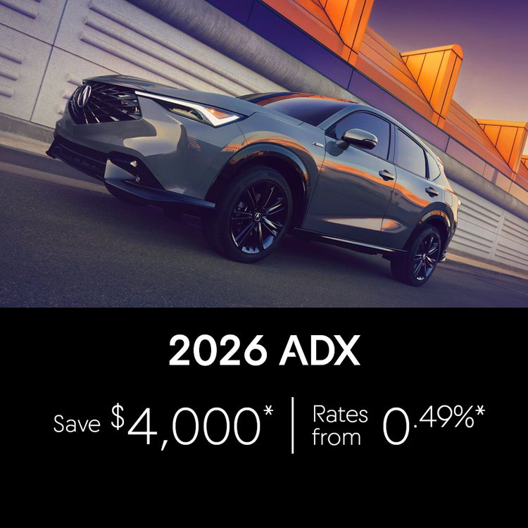2026 Acura ADX August Offer. Photo of Dark Gray Acura vehicle driving on the road.